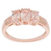 Oval pink Morganite sterling silver ring with three sparkling gemstones and delicate accents.